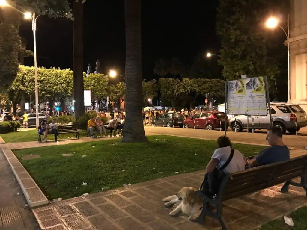 People sitting on a Bench at Night in Bari