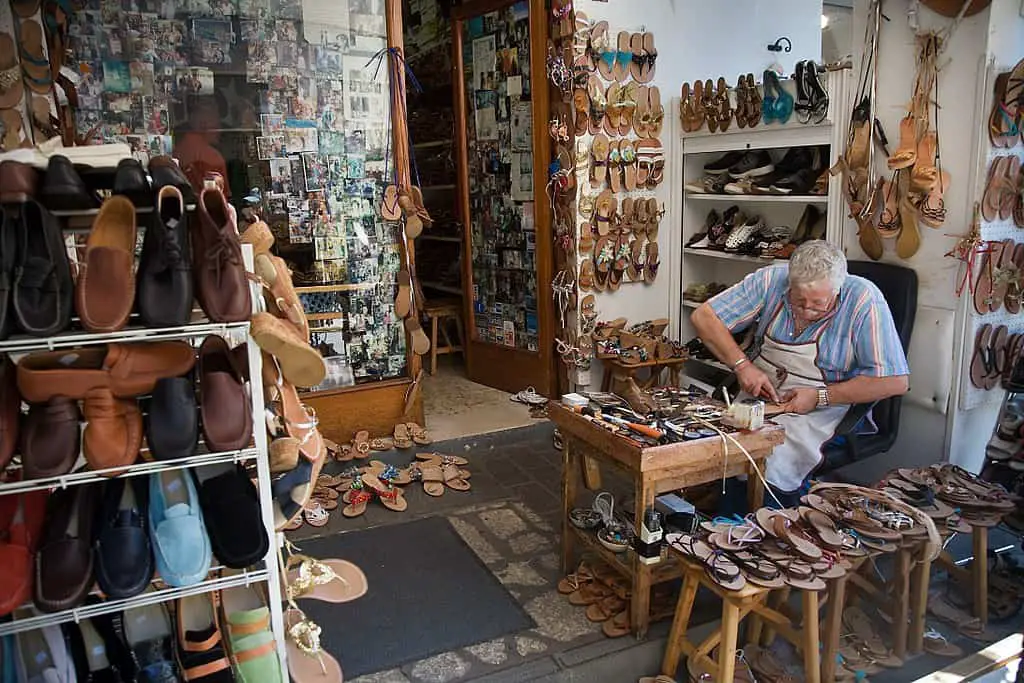 An Italian Cordwainer making shoes in his workshop